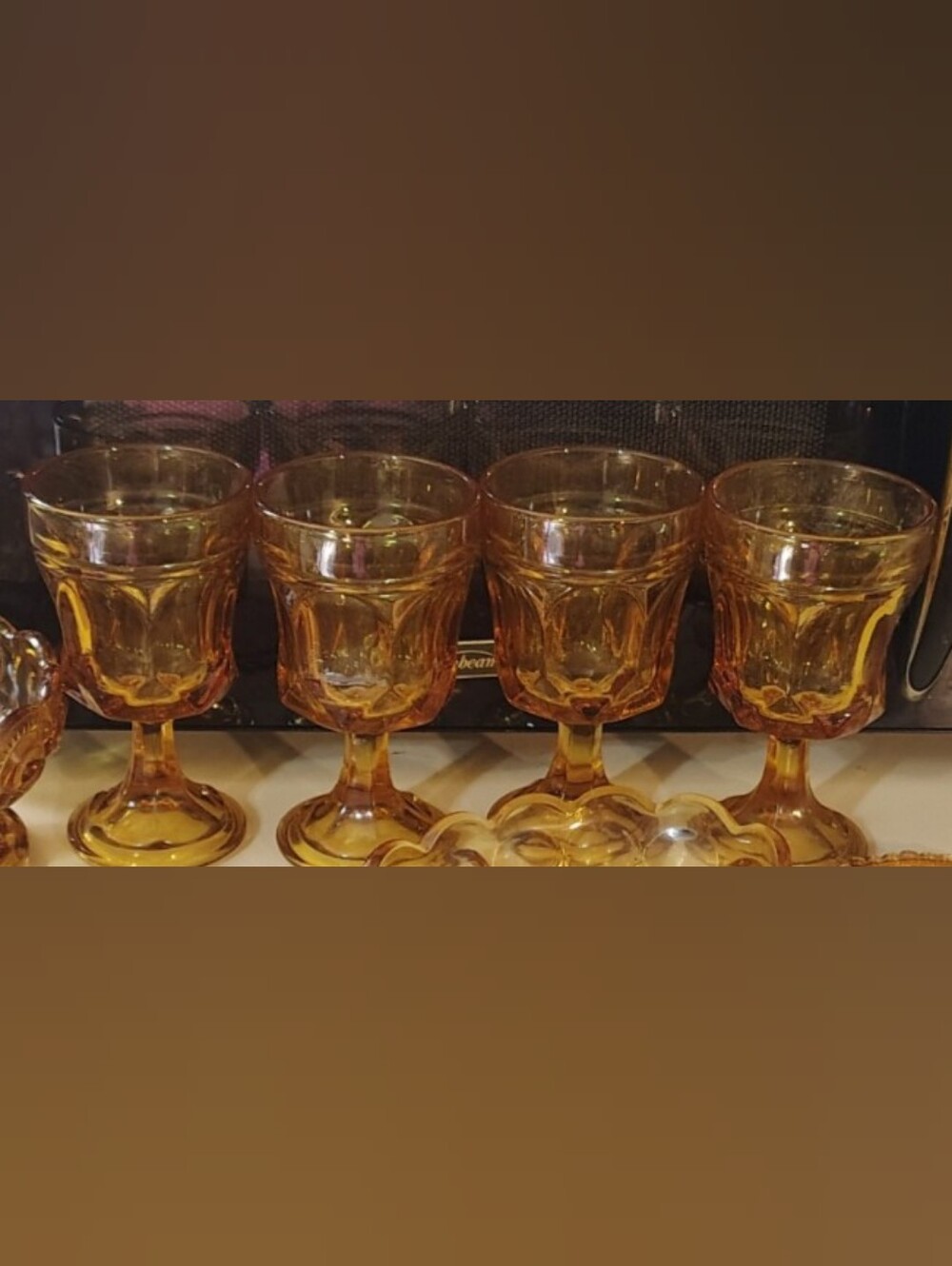 Pressed glass wine goblets in honey amber, 'Fairfield' pattern by Anchor Hocking